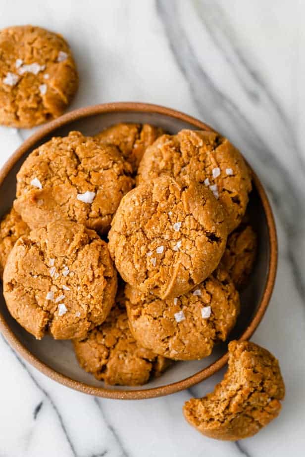 Bowl of the gluten free peanut butter cookies with a bite taken out of one of them