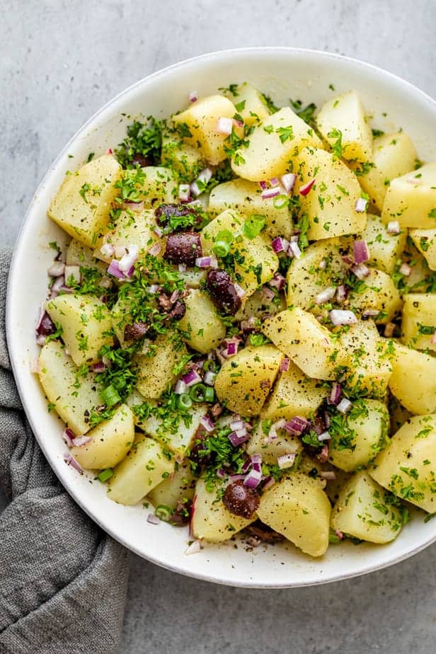 Mediterranean potato salad with onions, parsley and olives