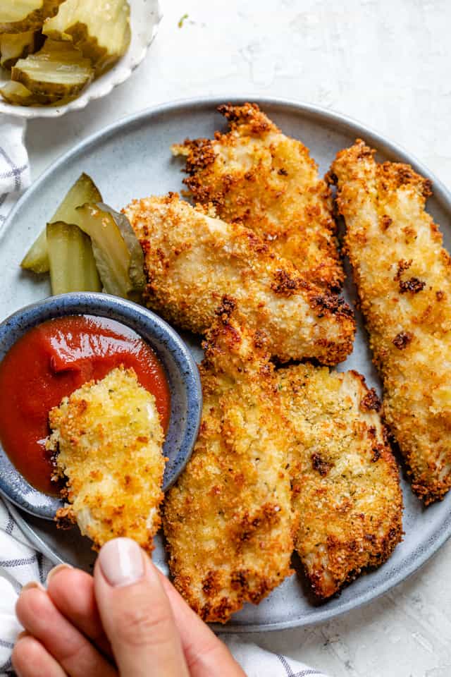 Air fried chicken tenders brined in pickle juice on a plate