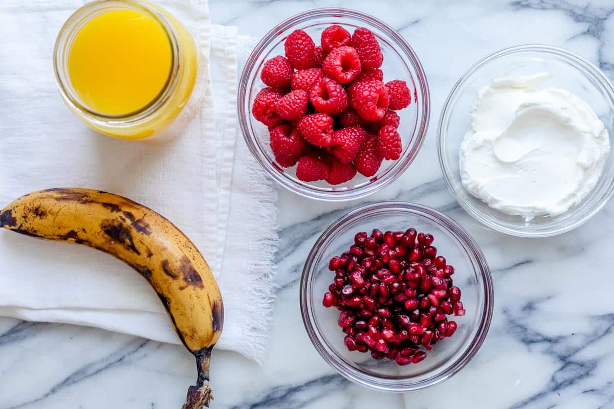 Five ingredients to make the smoothie recipe on marble background