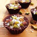 Make your own healthy chocolate treat at home with this Vegan Chocolate Pistachio Cups recipe - it only needs a few simple ingredients & no baking required