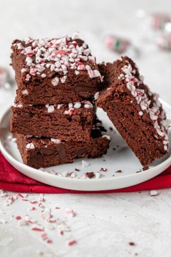 Final vegan peppermint brownies stacked on a small plate