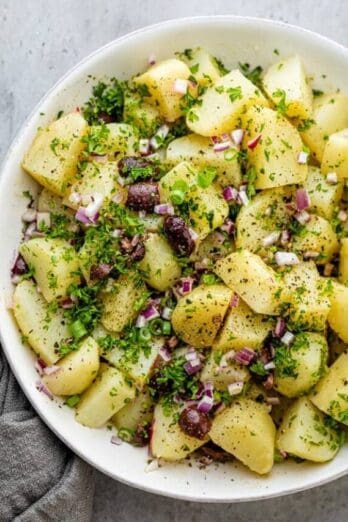 Mediterranean potato salad with onions, parsley and olives