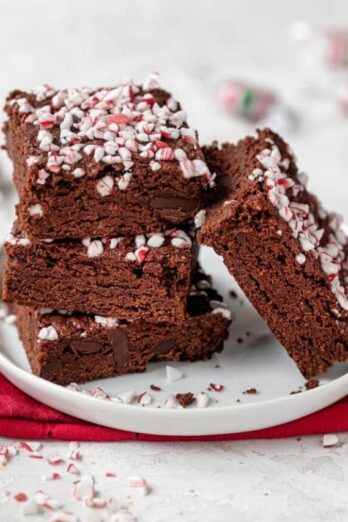 Final vegan peppermint brownies stacked on a small plate