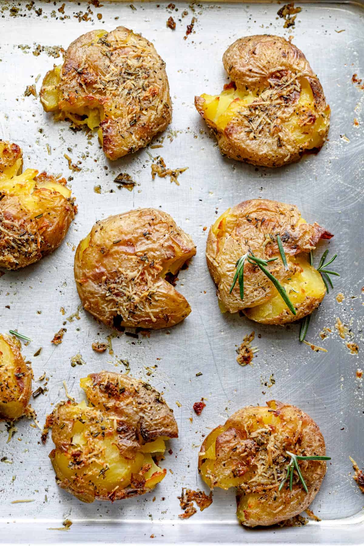These Rosemary Garlic Smashed Potatoes are a best of both worlds potato recipe - mashed and roasted! They are soft on the inside, crispy on the outside and bursting with rosemary garlicky flavor. It's a creative healthy side-dish the whole family will love!