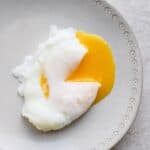 Poached egg on a gray plate