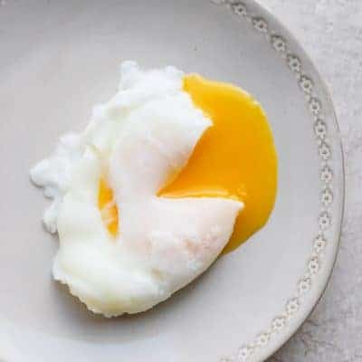 Poached egg on a gray plate