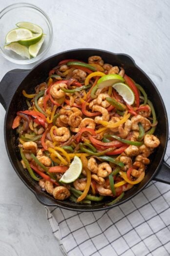Shrimp Fajitas with Bell Peppers and Avocado Salsa is quick/easy weeknight meal you can whip up in one cast iron skillet