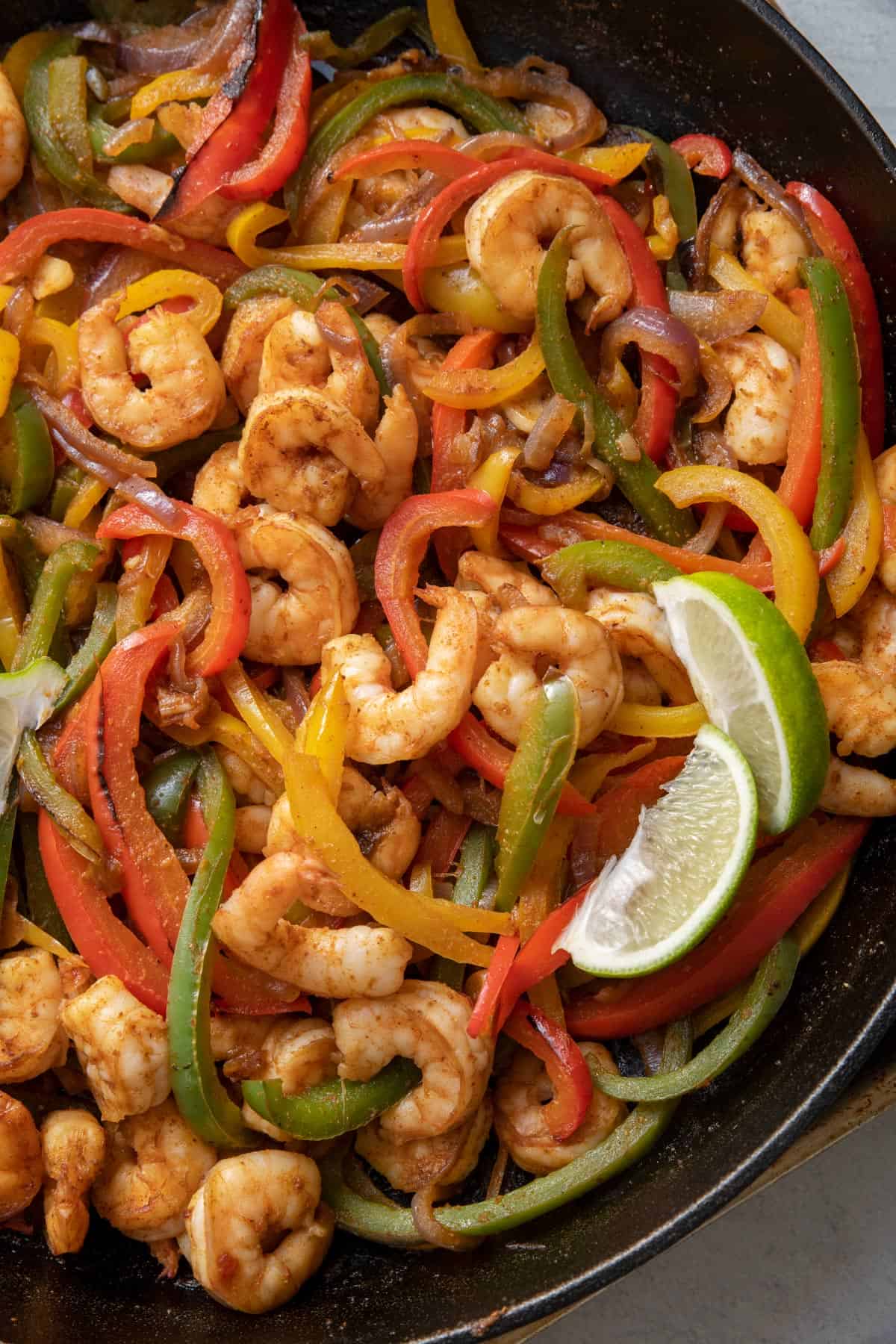 Close up shot of the shrimp fajitas in the dast iron skillet