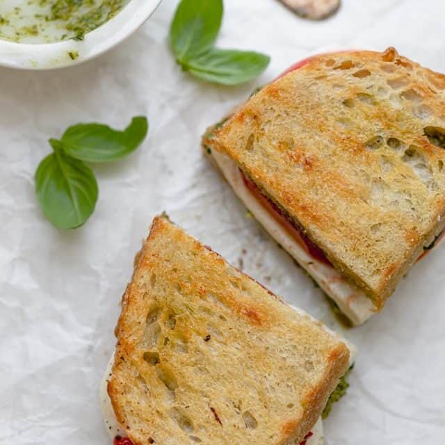 Grilled Mozzarella Sandwich made with walnut pesto, tomatoes and roasted red peppers