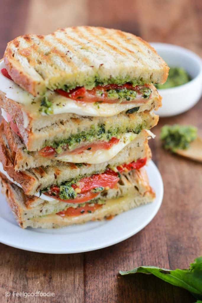 This Mozzarella Sandwich is made with fresh tomatoes and walnut pesto grilled with sourdough bread. It's easy to assemble and bursting with flavor!
