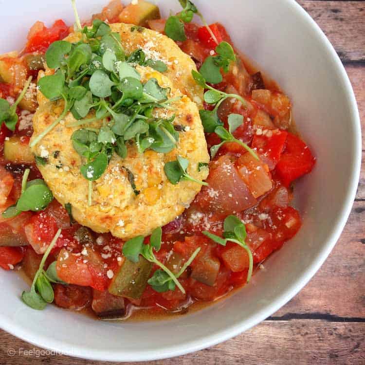 Vegetarian Chickpea Fritters With Ratatouille in a white bowl