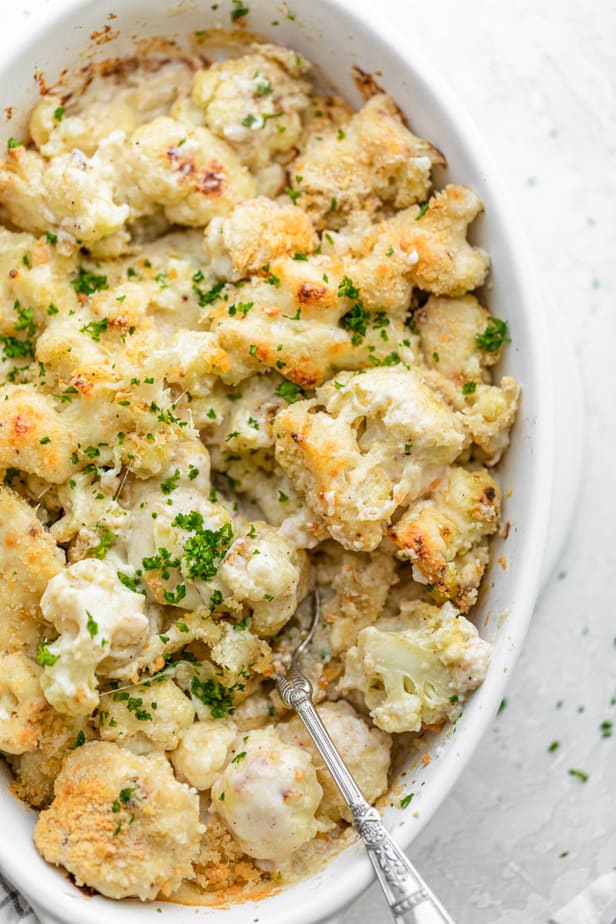 overhead shot of cauliflower au gratin in a white dish