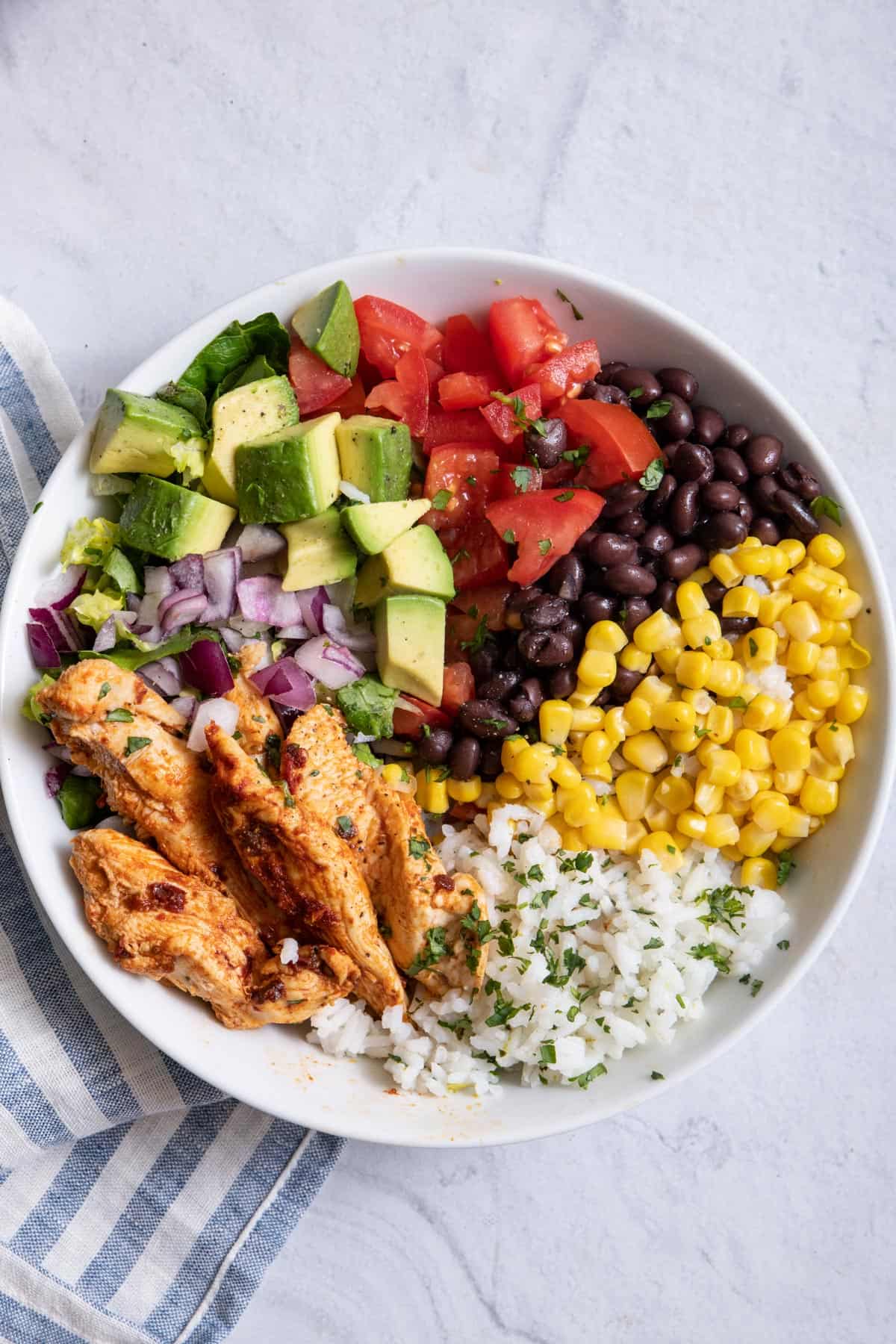 One chicken burrito bowl with all the toppings