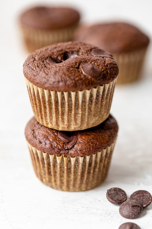 Double chocolate chip muffins stacked on top of each other