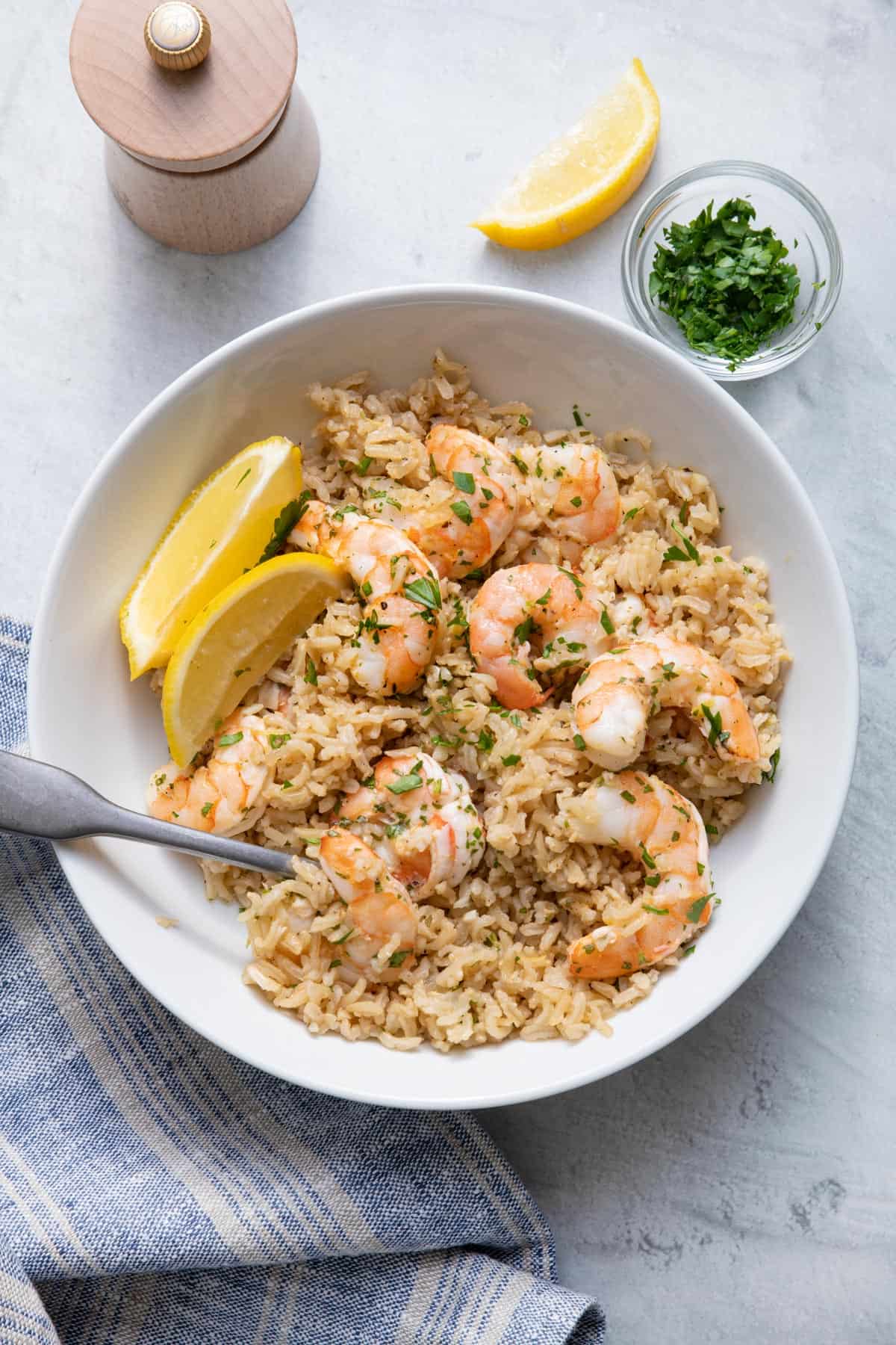 Close up of lemon herb shrimp stir fry served with rice