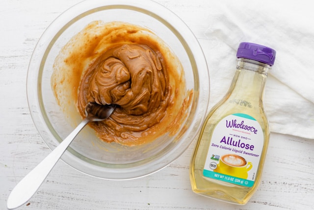 Mixing warm peanut butter with Wholesome Allulose