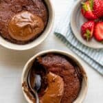 Nutella mug cake divided into two mugs made in one mug in one minute for one person, this Crumbly Nutella Mugcake is the perfect quick treat for a sweet tooth!