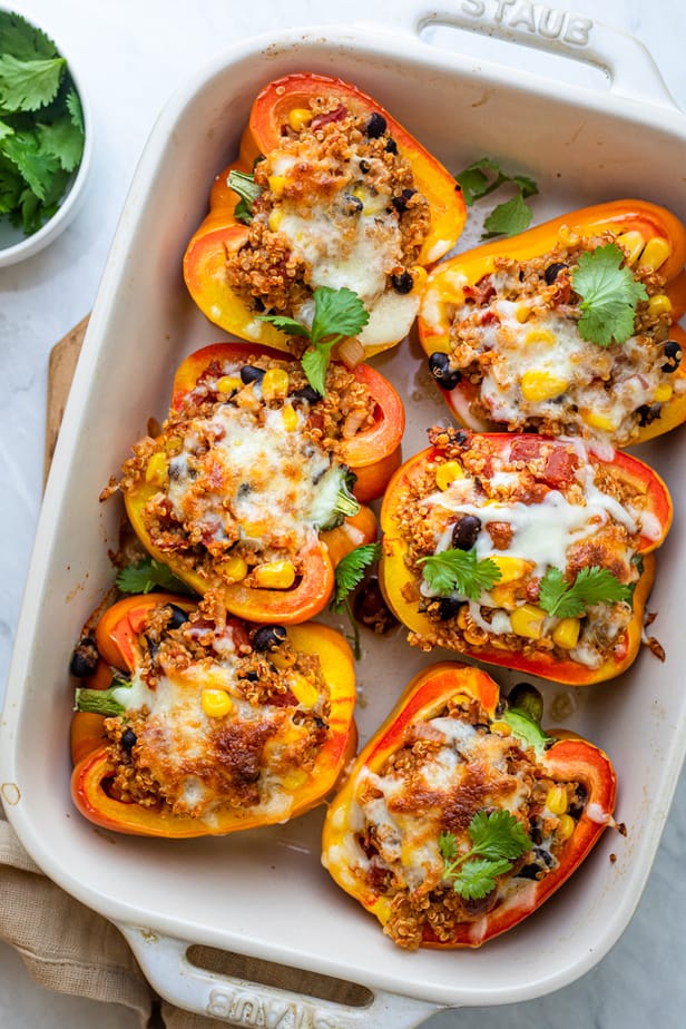Quinoa stuffed peppers after cooked topped with cheese and cilantro