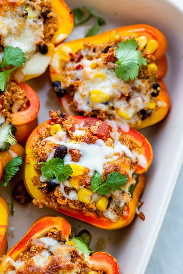 Close up shot of quinoa stuffed peppers with melted cheese