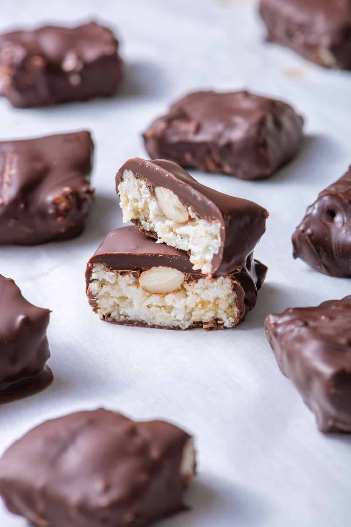 Almond joy bars cut in half stacked on top of each other