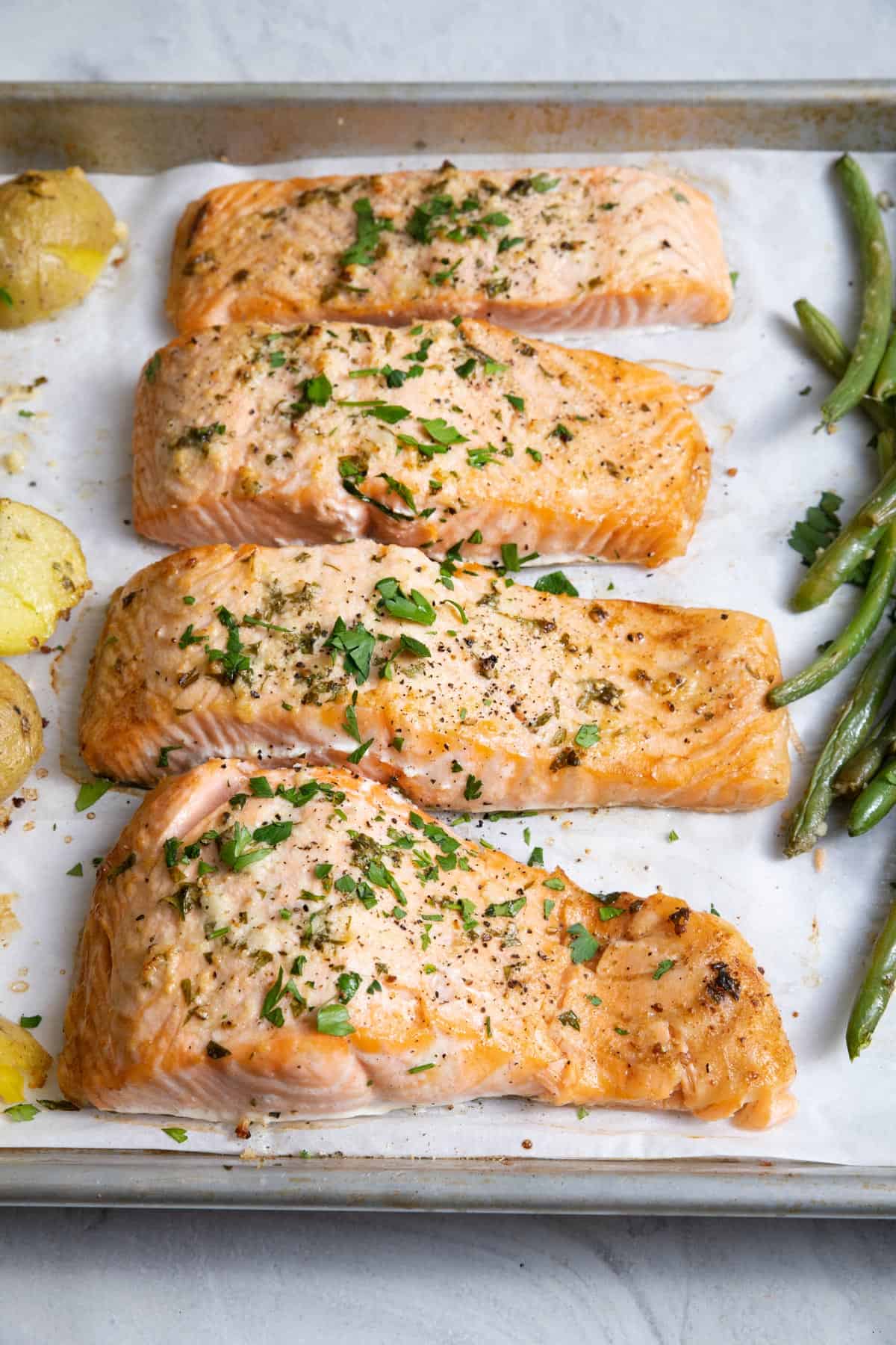 Close up shot of the sheet pan salmon on baking dish