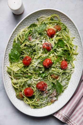 Large plate of zoodles with blistered tomatoes
