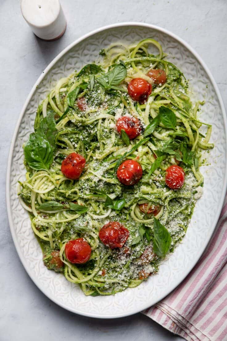 Large plate of zoodles with blistered tomatoes