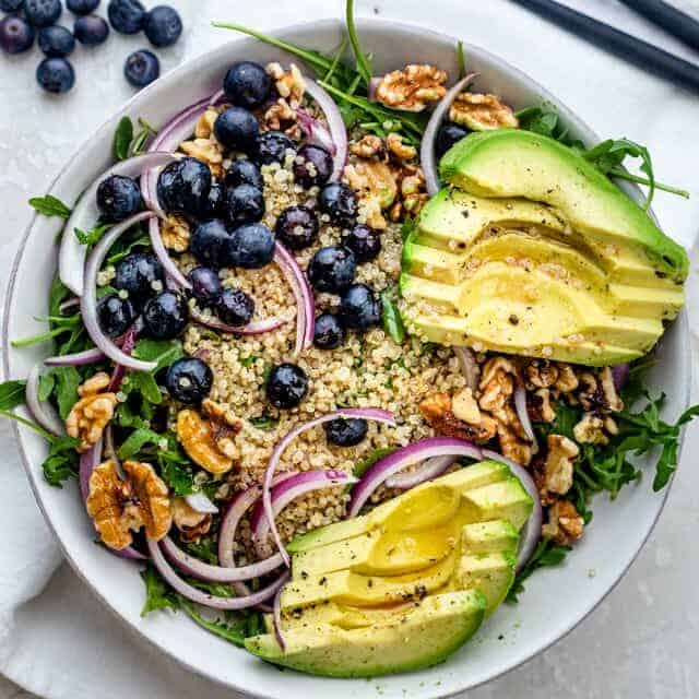 Avocado blueberry salad with arugula and quinoa