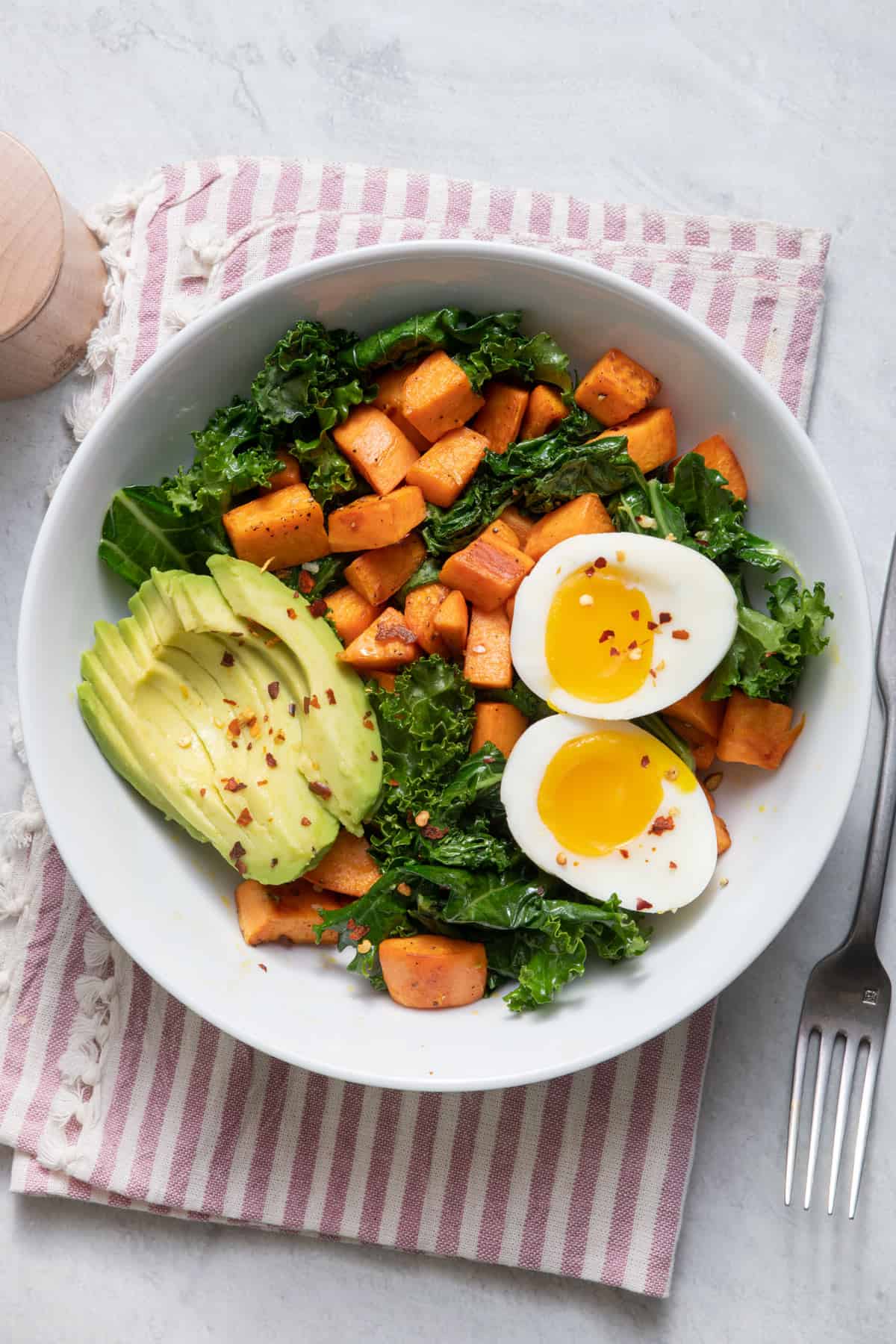 Egg and sweet potato breakfast bowl with avocado