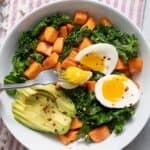 Top down shot of the egg and sweet potato breakfast bowl topped with avocado