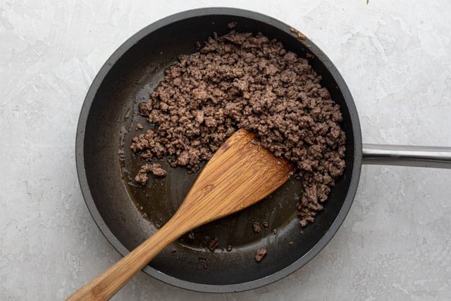Frying pan with ground beef cooked