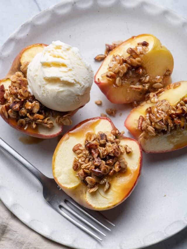 Cinnamon Baked Apples with Oats & Pecans mixture on top and scoop of vanilla ice cream