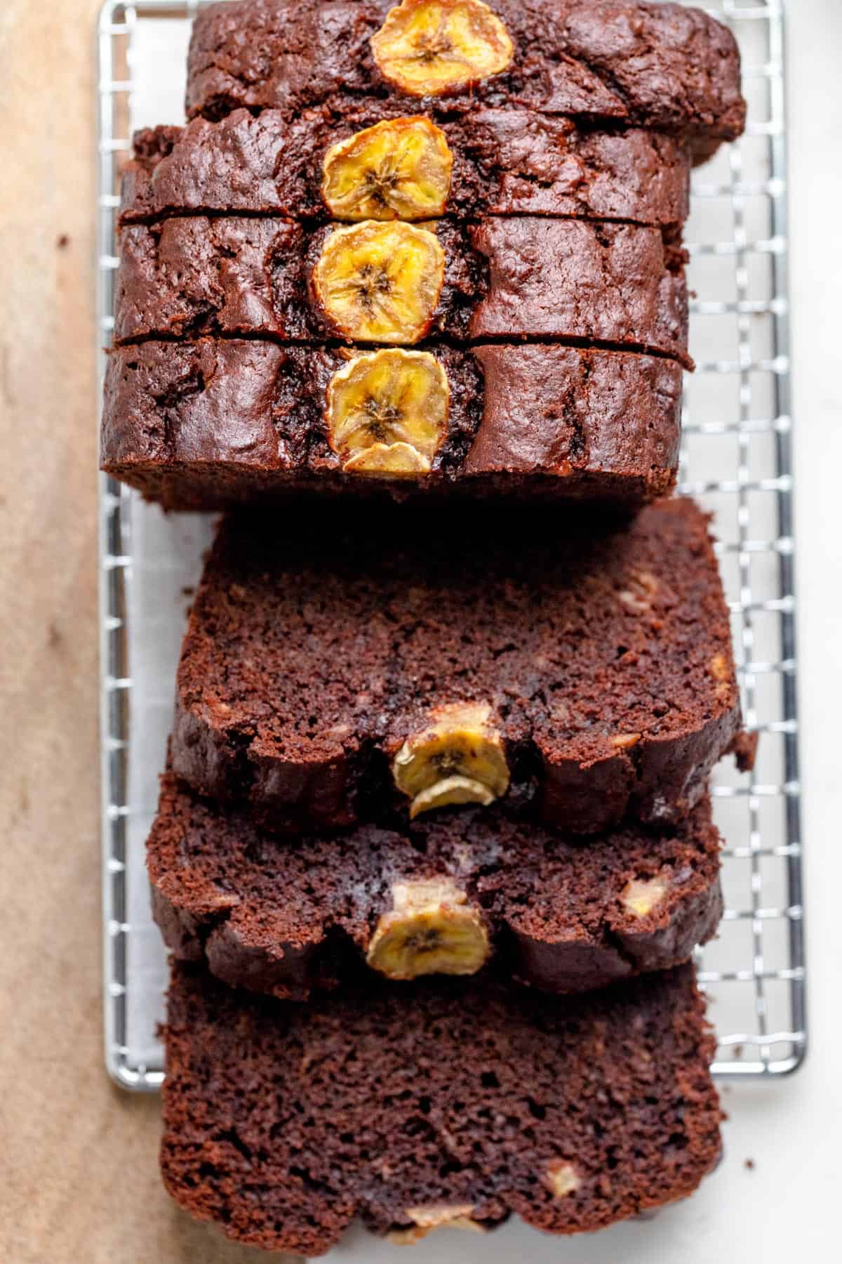 Chocolate Peanut Butter Banana Bread is an easy quick bread cut into slices on wire rack to show the consistency