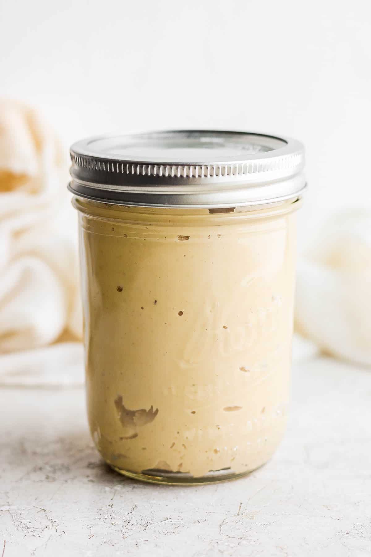 Cashew butter in a mason jar with lid on.