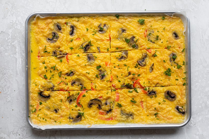 Sheet pan eggs cut into squares before serving