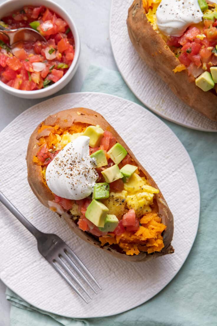 Loaded breakfast sweet potatoes with eggs and toppings