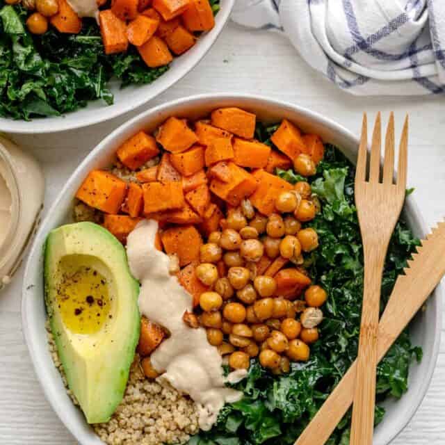 Quinoa buddha bowl made with chickpeas and sweet potatoes and topped with avocado
