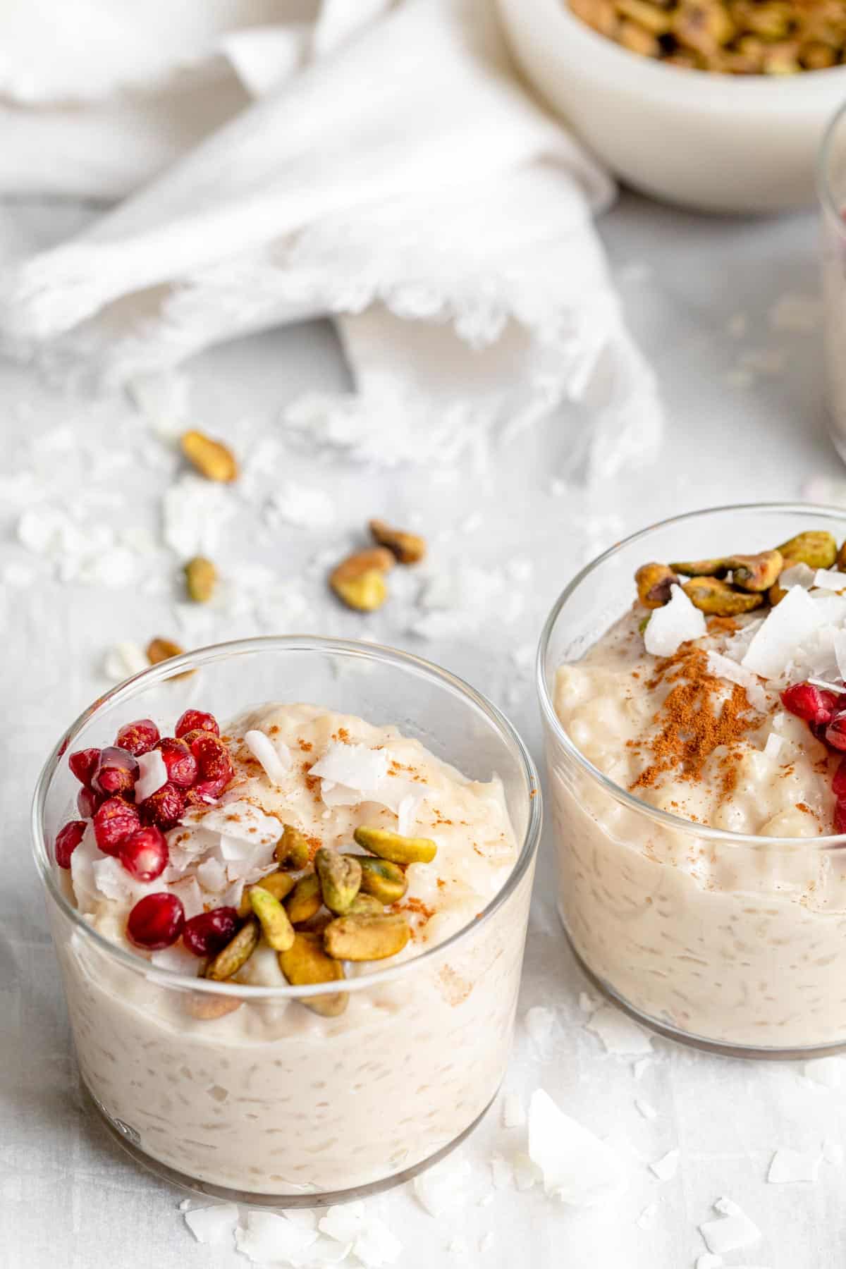 Angle show of the almond milk rice pudding jars with toppings
