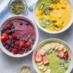 3 types of smoothie bowls garnished with fresh fruit