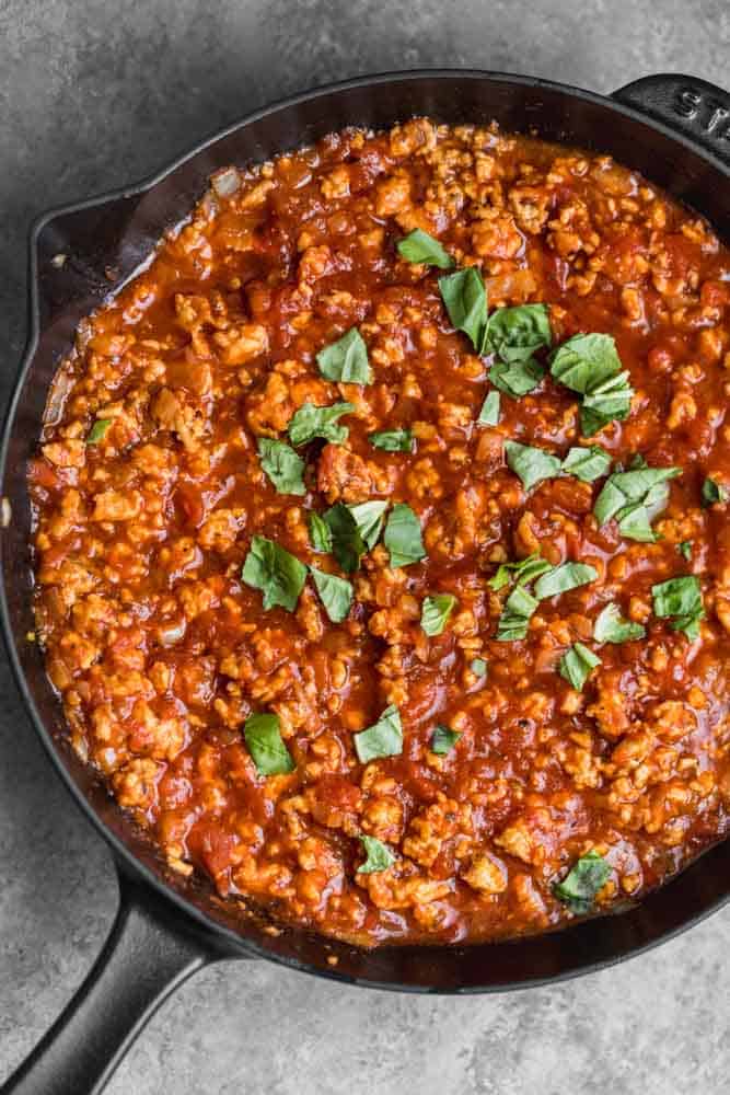 Cooked ground turkey and sauce in a skillet
