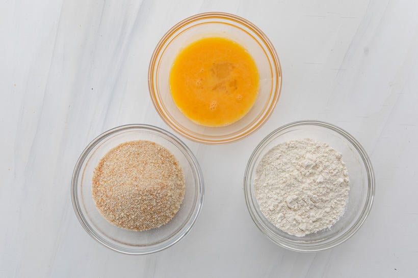 Three bowls for breading - flour, egg wash and panko breadcrumbs