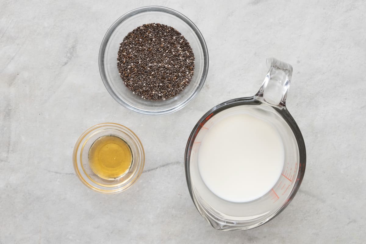 Ingredients to make 3-Ingredient pudding - almond milk, chia seeds and honey.