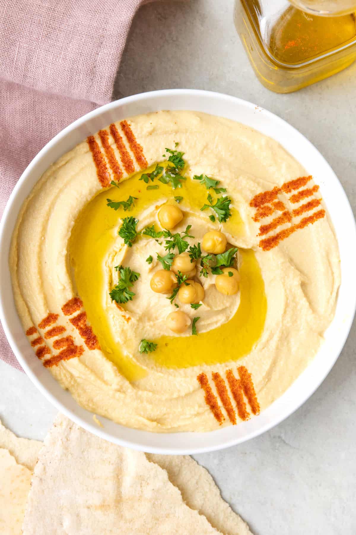 Close up shot of hummus plated in a shallow dish