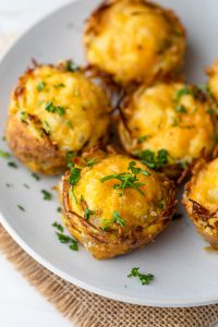 Hash brown eggs nests topped with parsley