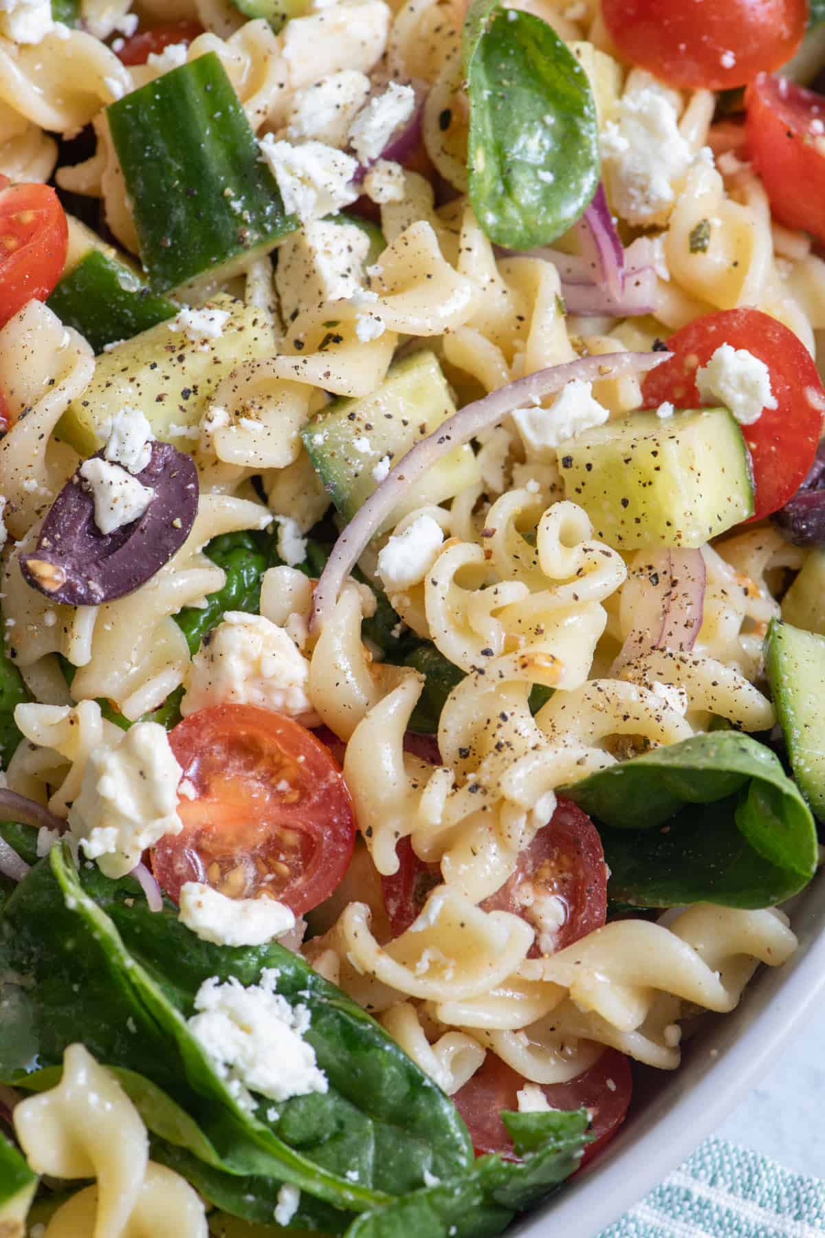 Close up of pasta salad showing each ingredient.