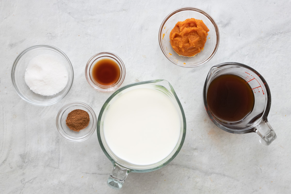 Ingredients to make latte recipe - coffee, milk, pumpkin spice, sugar, pumpkin puree and vanilla extract.