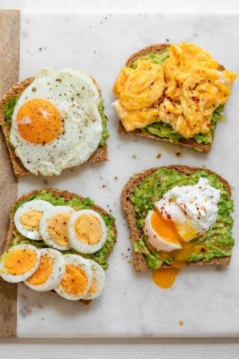 Avocado toast with eggs three ways: scrambled, poached and fried.