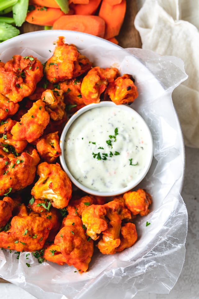 Large bowl of cauliflower buffalo bites with ranch dipping sauce