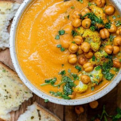 Sweet potato cauliflower soup in a white bowl